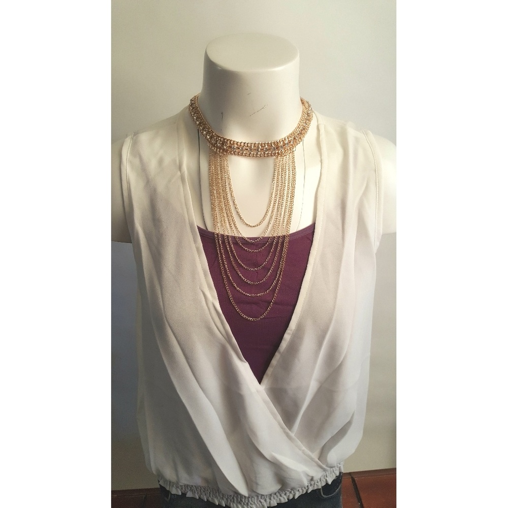 Low cut V neck white blouse.